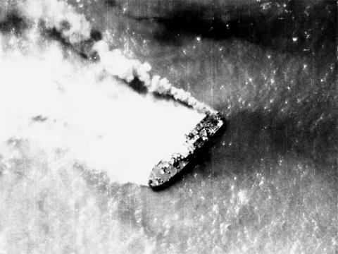 A North Vietnamese Shantou-class gunboat burns near Hon Ne Island